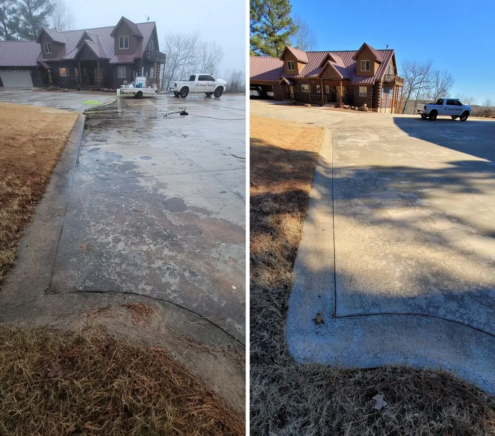 A wide concrete driveway in front of a log home, blotchy and stained on the left and clean on the right, with a 501 Pressure Washing truck parked by the house